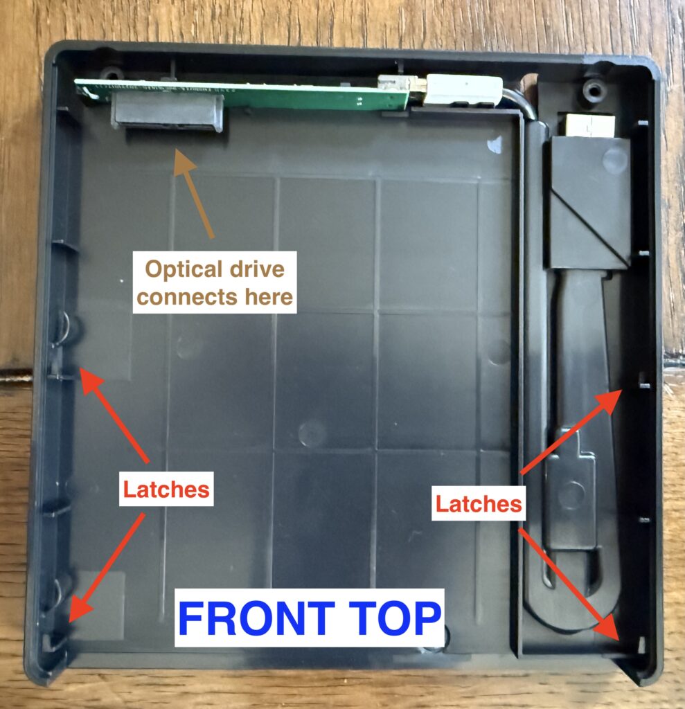 a picture of the inside of the enclosure, showing 4 latches, 2 on either side, near the opening