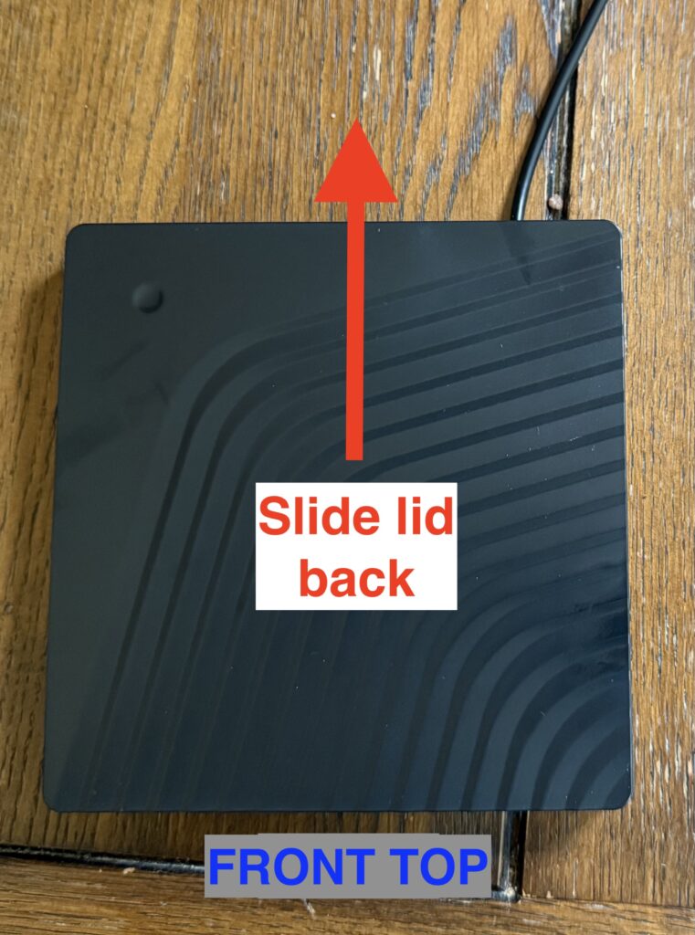 a picture of the top of the enclosure, saying to slide the lid back to open